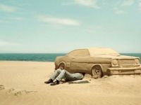 Autoreparatur am Strand